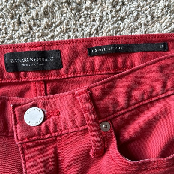 Muted red jeans. Waist is 15”, rise is 10” and length is 27” - Picture 3 of 7